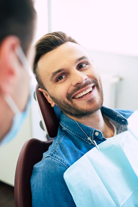 Man smiling and relaxed in the dental chair