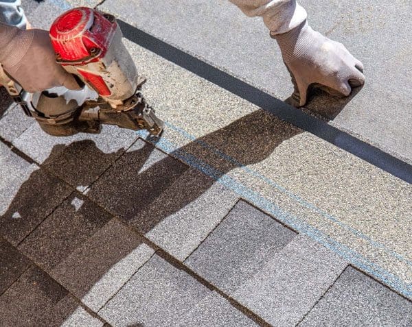 Roofer Installing new Shingles